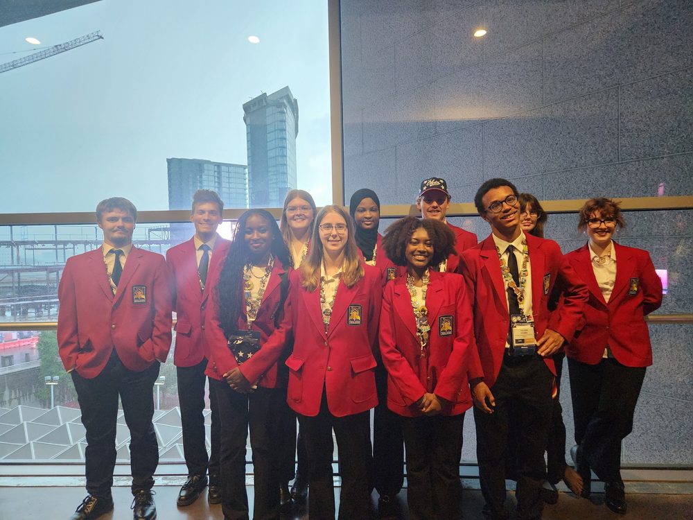 Eastland-Fairfield students in red SkillsUSA blazers pose together at the 2025 SkillsUSA National Conference in Atlanta.