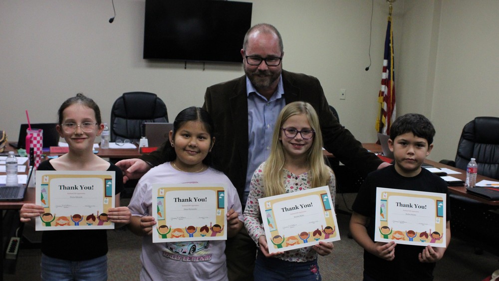 Perrin, Diana, Brynlee, and Kaiden Lead the Pledge at November School Board Meeting!