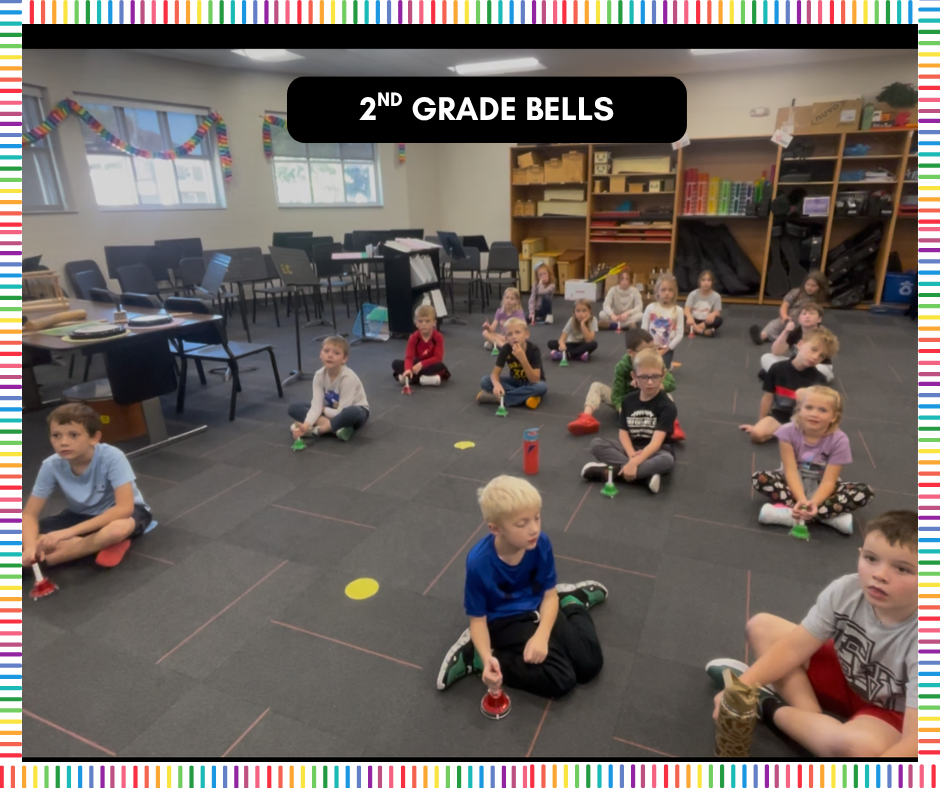 2nd Grade is playing lap bells in this picture - they are following the music on the whiteboard. 