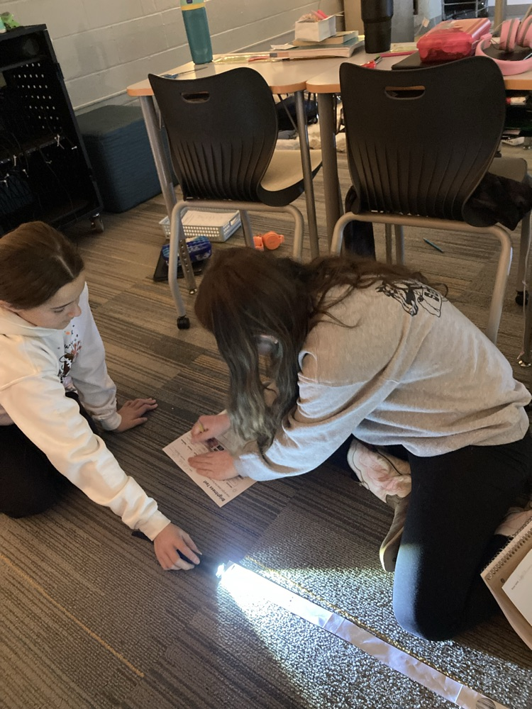 5th grade is learning about the solar system. Here, they are modeling the sun’s brightness on different planets to make a decision about where to send a solar powered rover.