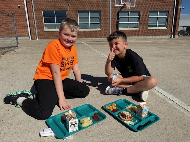 This student from Mrs. Lawson's class earned lunch with the teacher & friend. They chose to enjoy lunch outside with the great weather! 