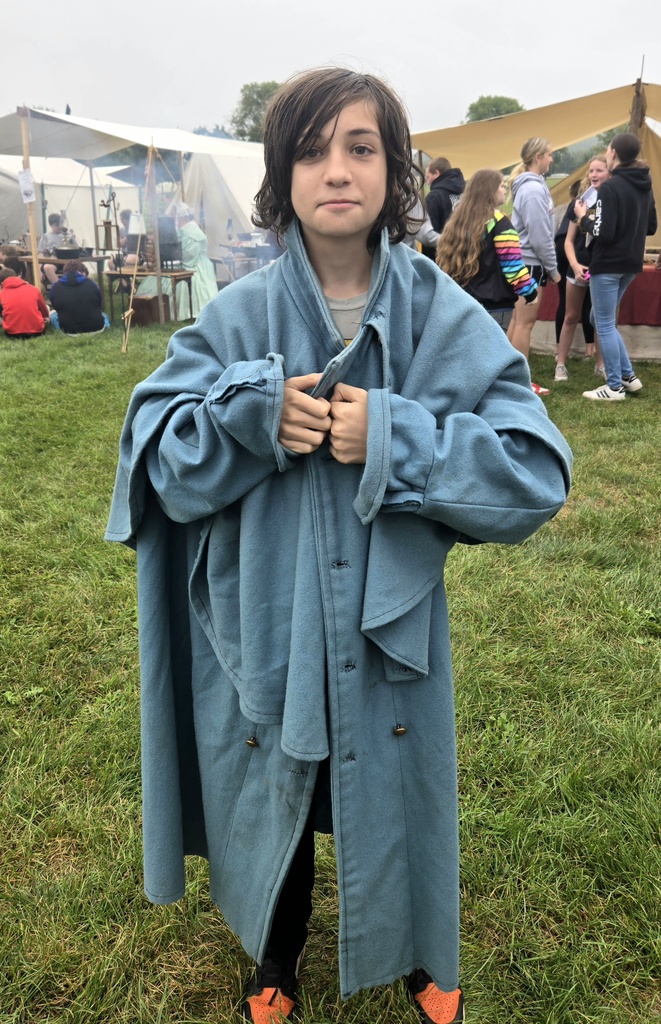 Several students got in on trying the Civil War coat on. 