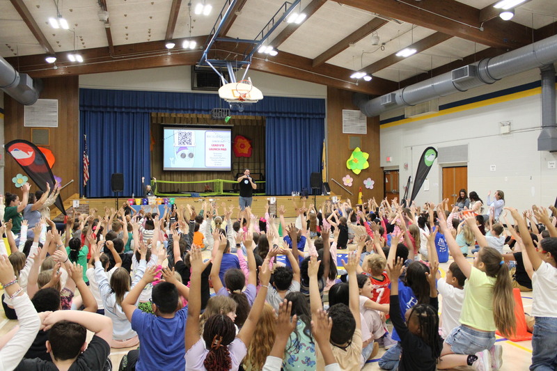 Students actively participating in an assembly 