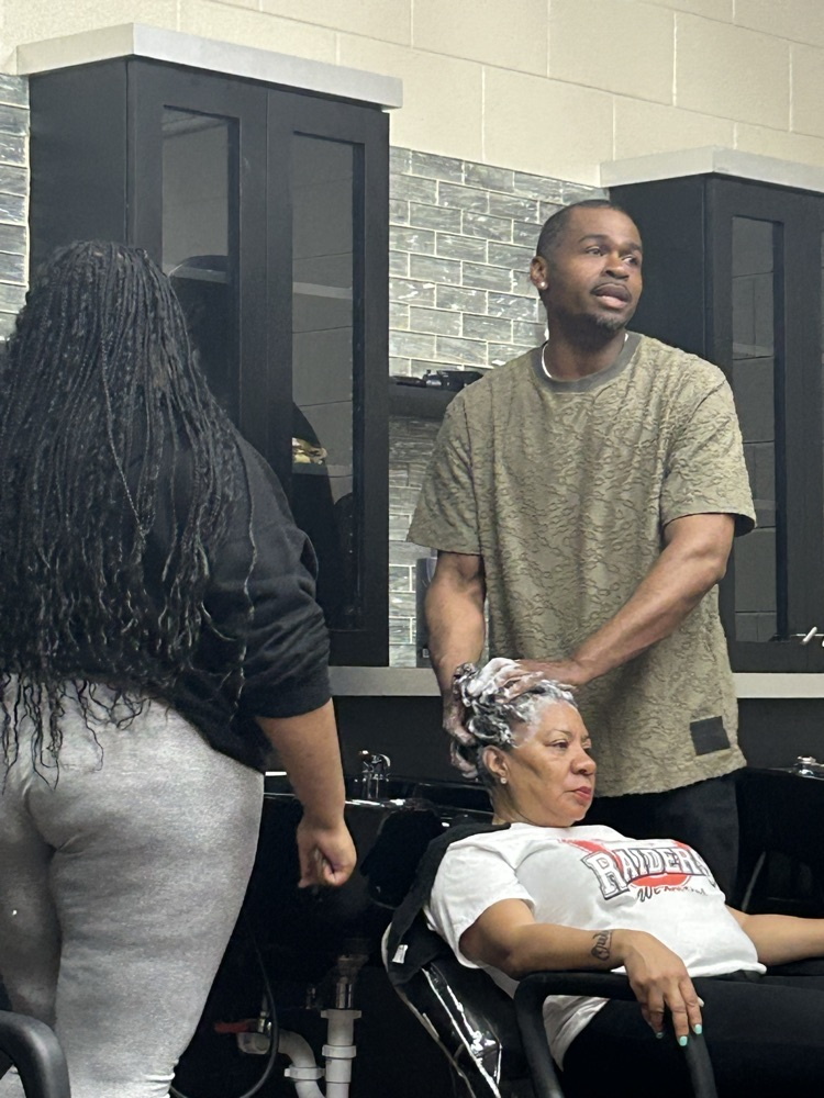 As a part of Ecorse High School’s annual Career Day, Vice Principal, Ms. Felton, had her hairstylist, Germain Evans, shampoo, blow-dry and silk press her hair with a live demonstration to the cosmetology class with student participation.