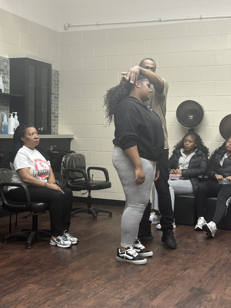 As a part of Ecorse High School’s annual Career Day, Vice Principal, Ms. Felton, had her hairstylist, Germain Evans, shampoo, blow-dry and silk press her hair with a live demonstration to the cosmetology class with student participation.