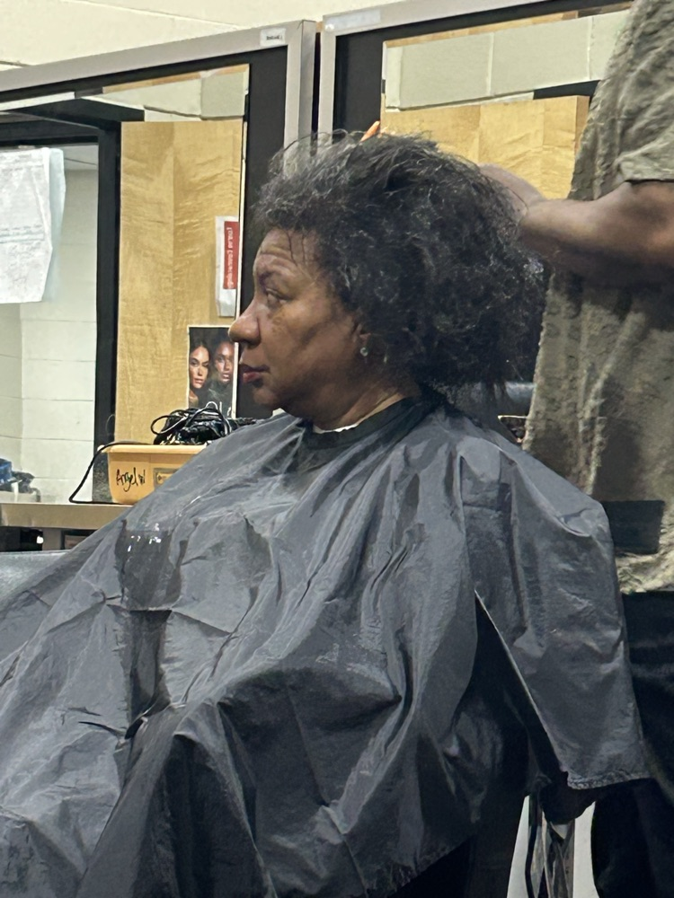 As a part of Ecorse High School’s annual Career Day, Vice Principal, Ms. Felton, had her hairstylist, Germain Evans, shampoo, blow-dry and silk press her hair with a live demonstration to the cosmetology class with student participation.