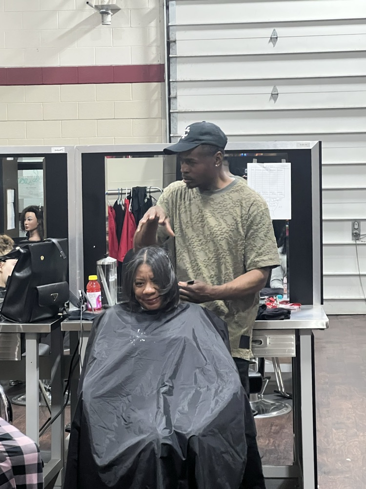 As a part of Ecorse High School’s annual Career Day, Vice Principal, Ms. Felton, had her hairstylist, Germain Evans, shampoo, blow-dry and silk press her hair with a live demonstration to the cosmetology class with student participation.