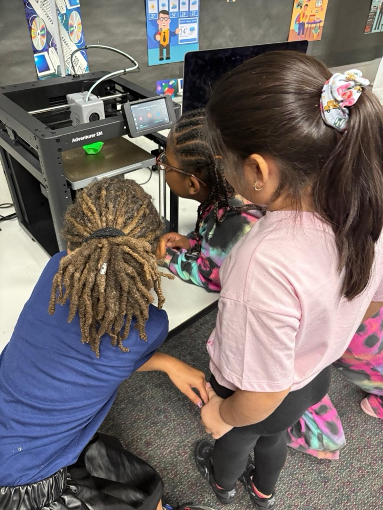 student observing 3D printer
