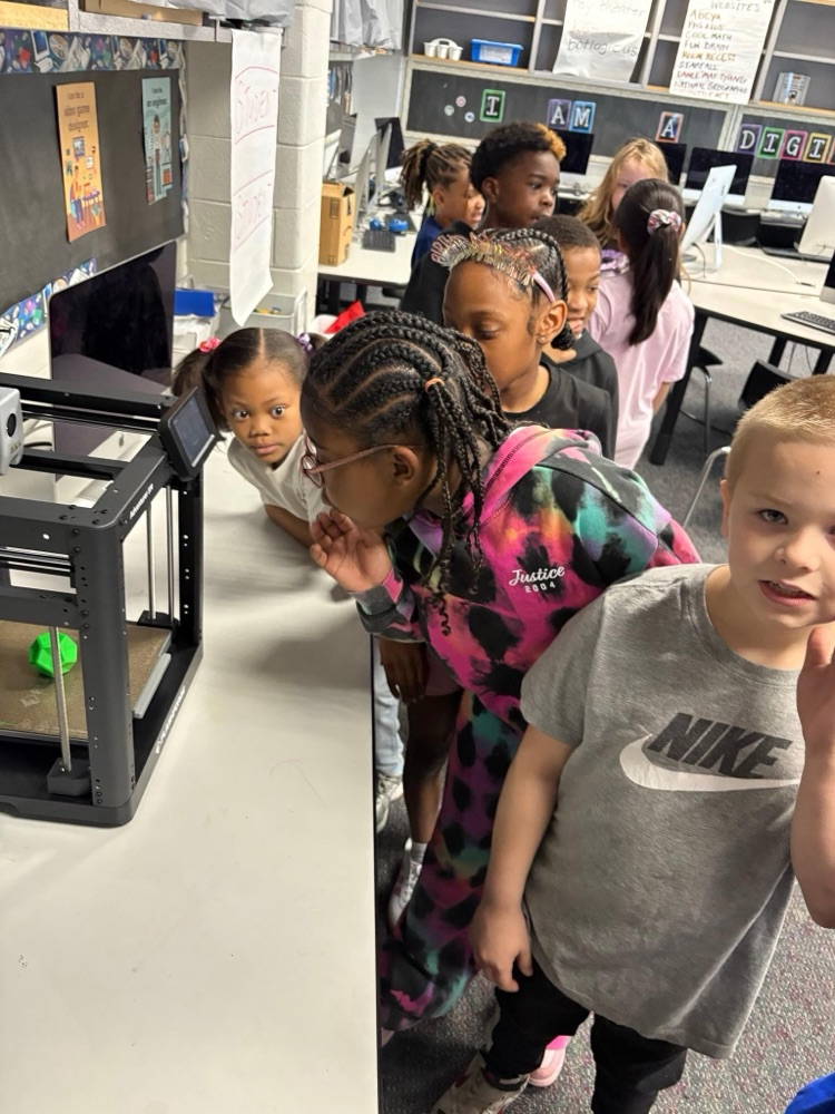 student observing 3D printer