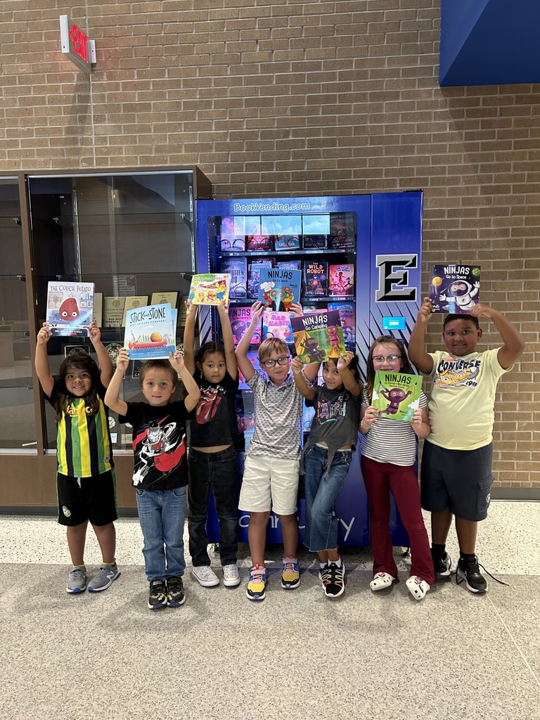 1st graders hard at work reading.