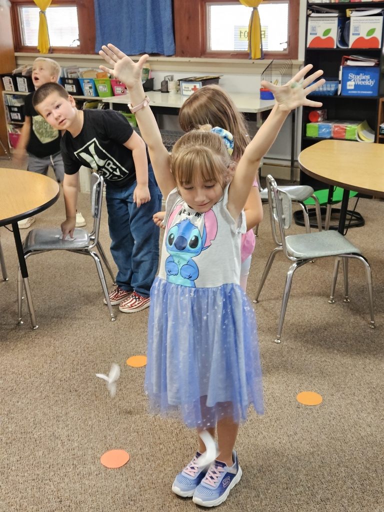 a girl dropping paper seeds