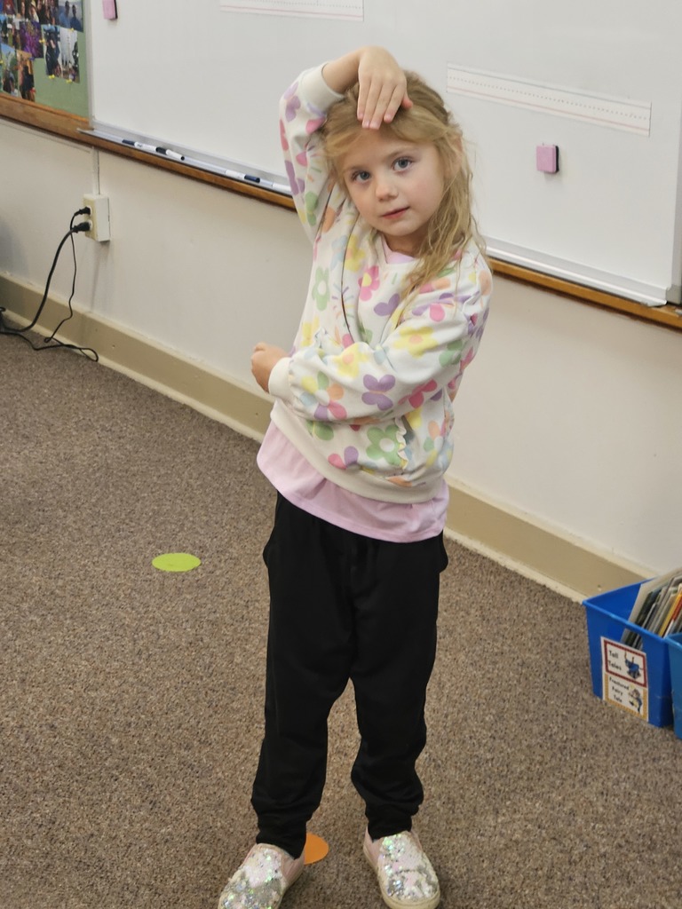 a girl making the letter f with her body