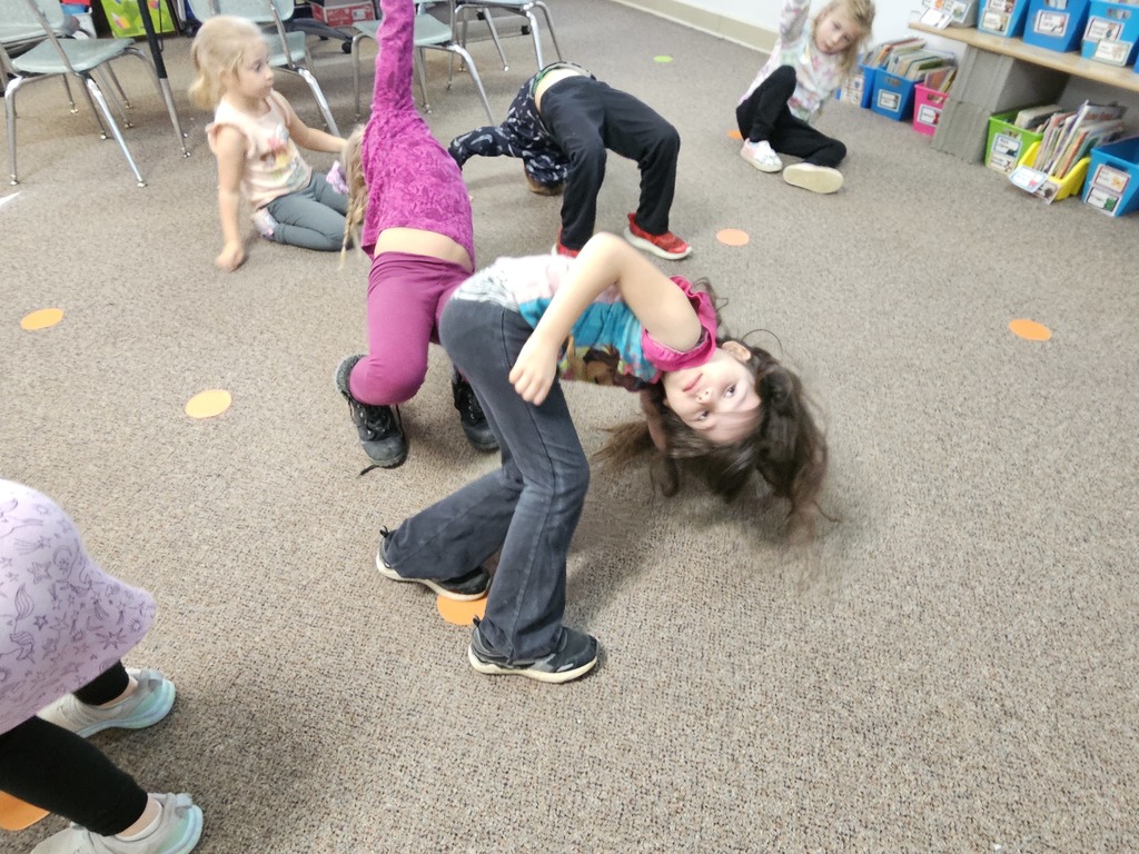 a girl doing a front bend to make an arch