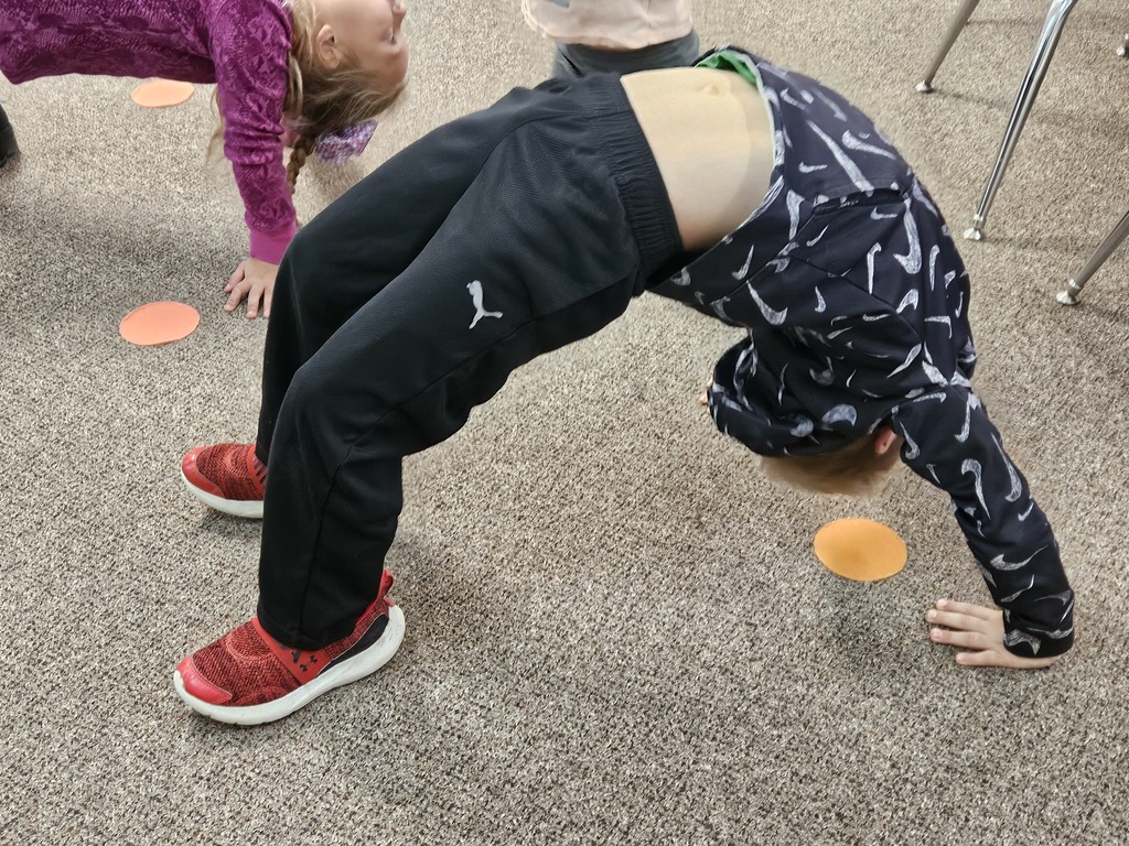 a boy doing a back bend