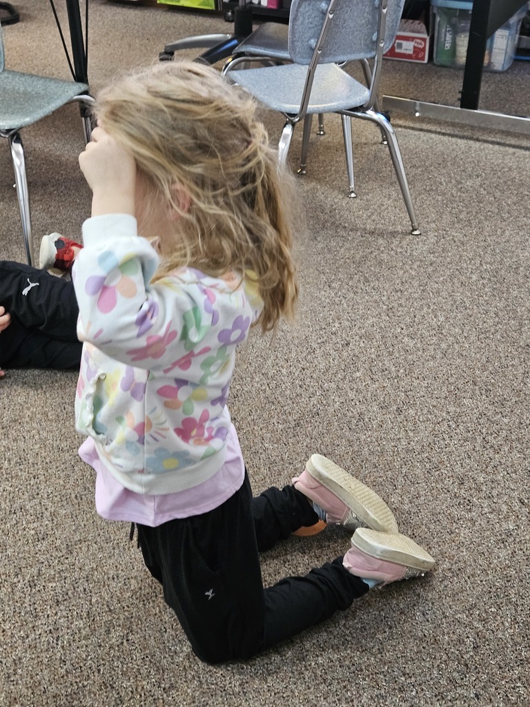 a girl making the letter s with her body
