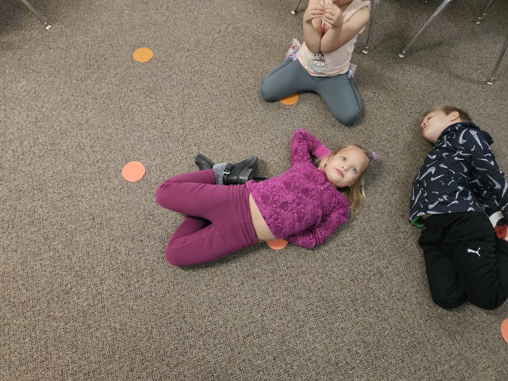 A girl with her body in a circle to make the letter o