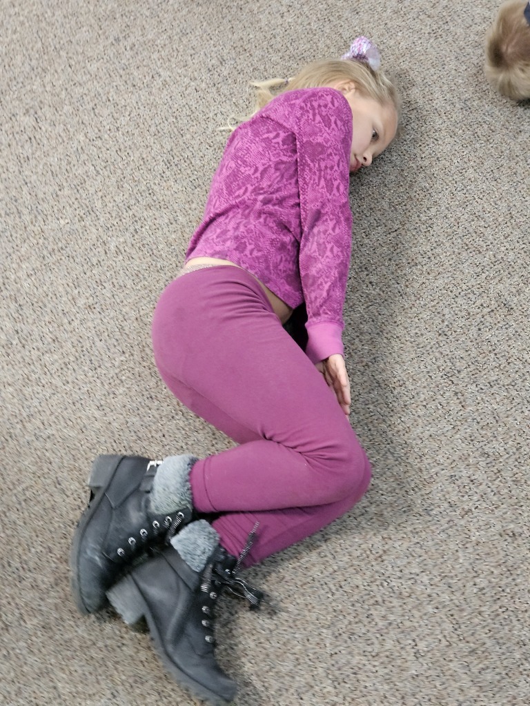 a girl making the letter s with her body