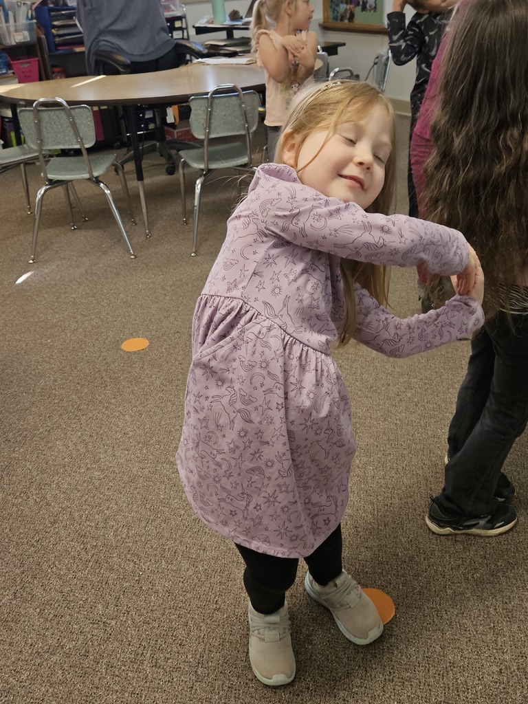 a girl making the letter p with her body