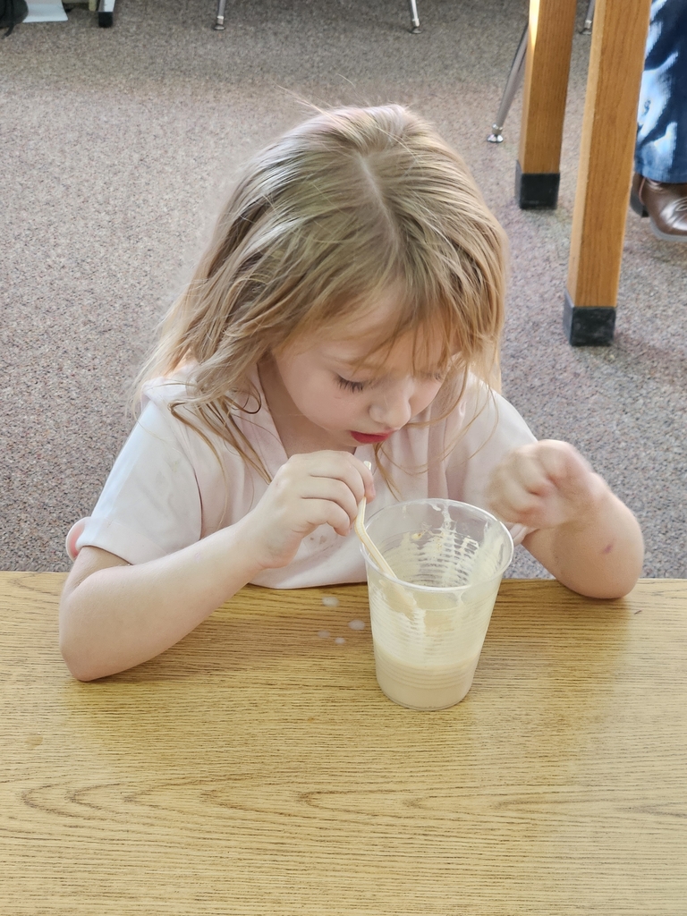 a girl drinking a root beer float