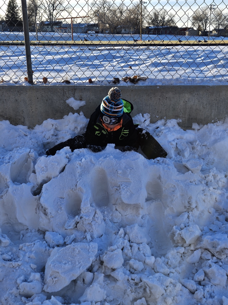 boy with snow pile