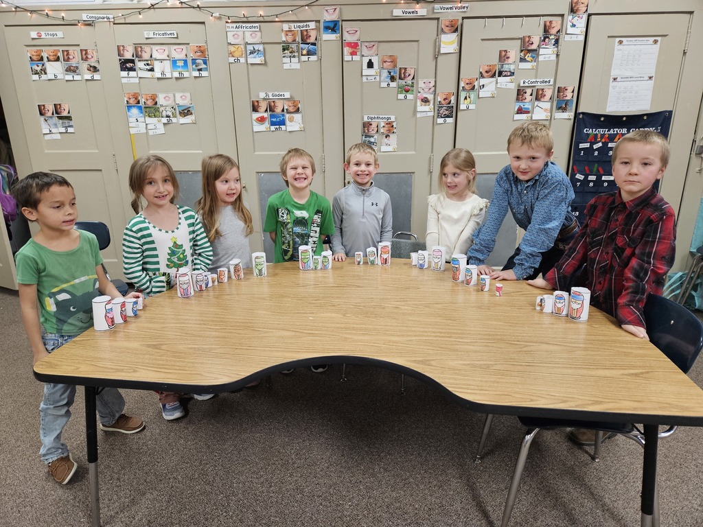 8 kids with paper Santa's