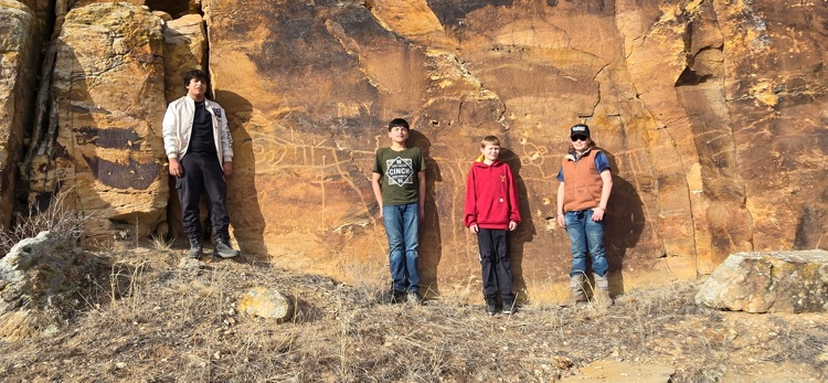 Middle School boys exploring petroglyphs 