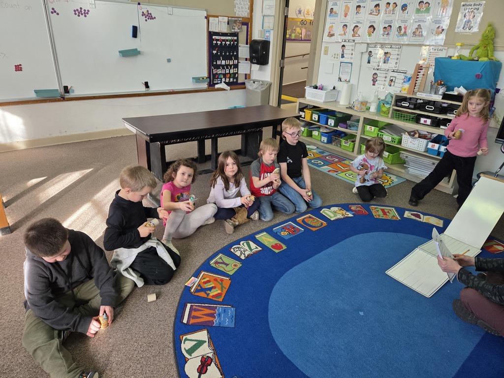 8 kids sitting in a row