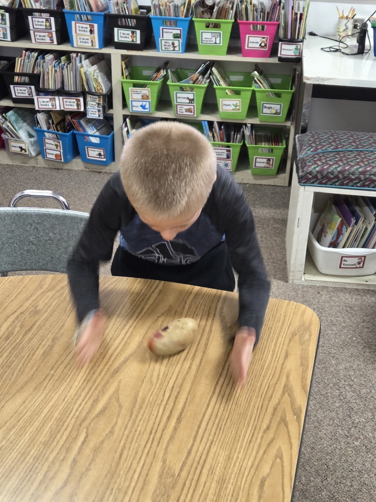 1 boy spinning a potato 
