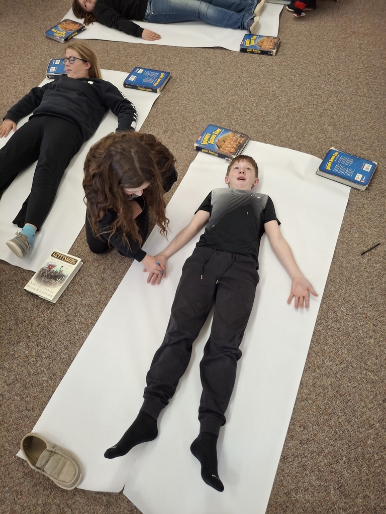 The 6th graders have been learning about the caste system in Ancient India! They traced each other and then created a character from each of the castes. 