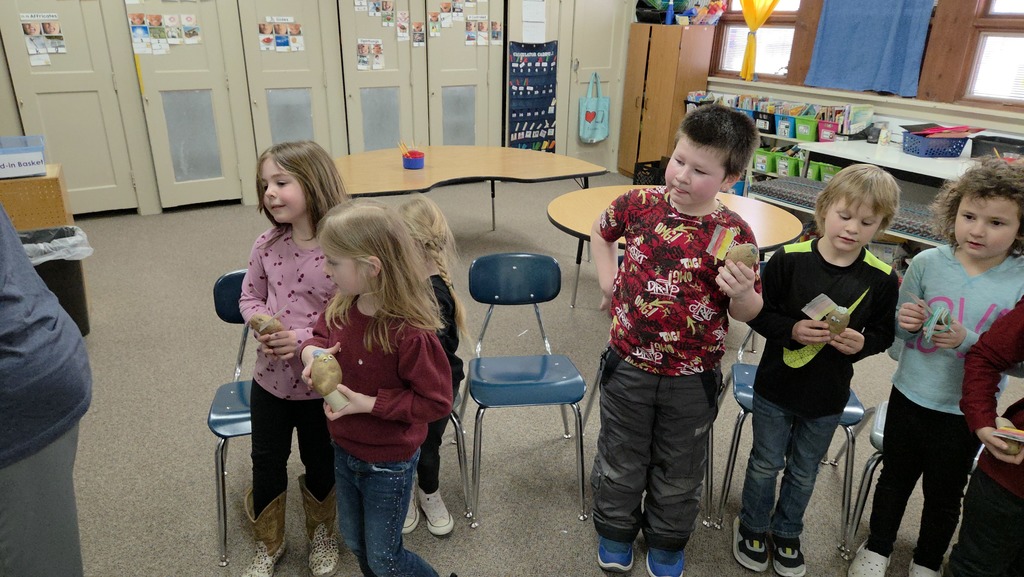 6 kids with potatoes