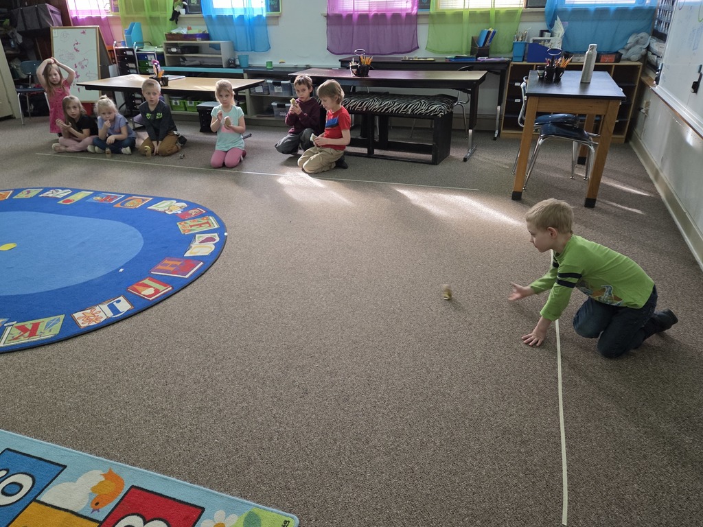 a boy rolling a potato