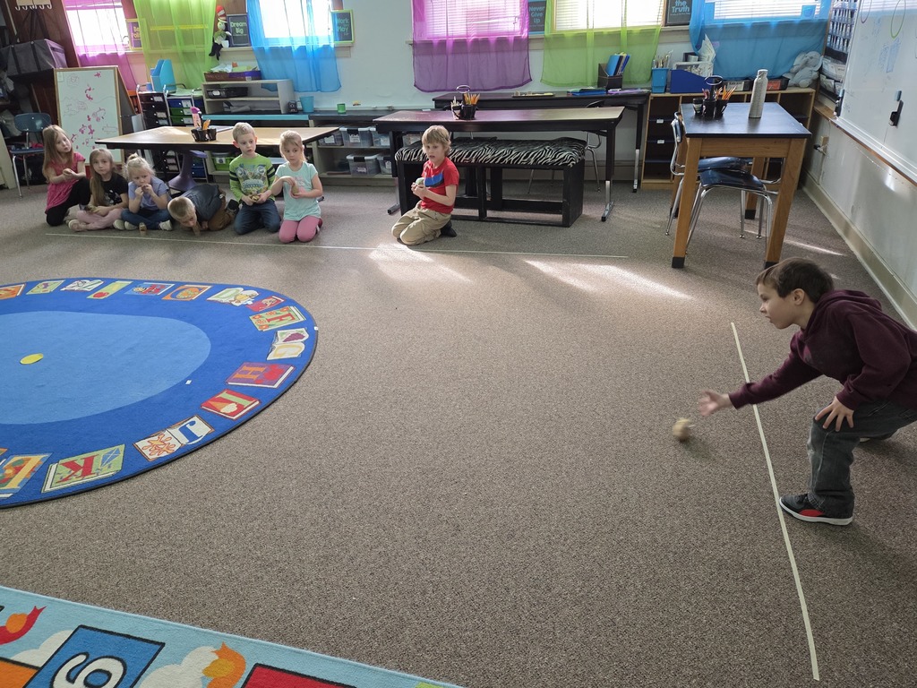 a boy rolling a potato