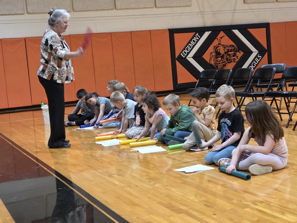 11 kids and 1 teacher playing boom whackers