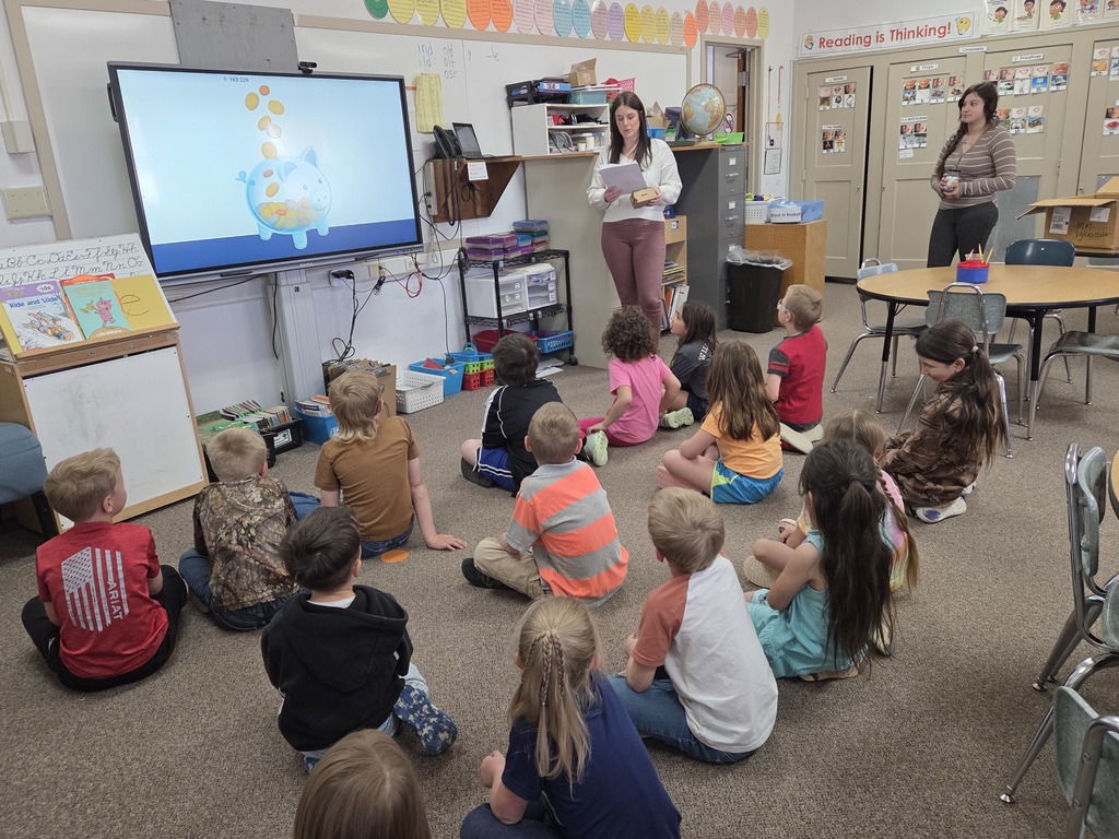 16 kids listening to 2 adults