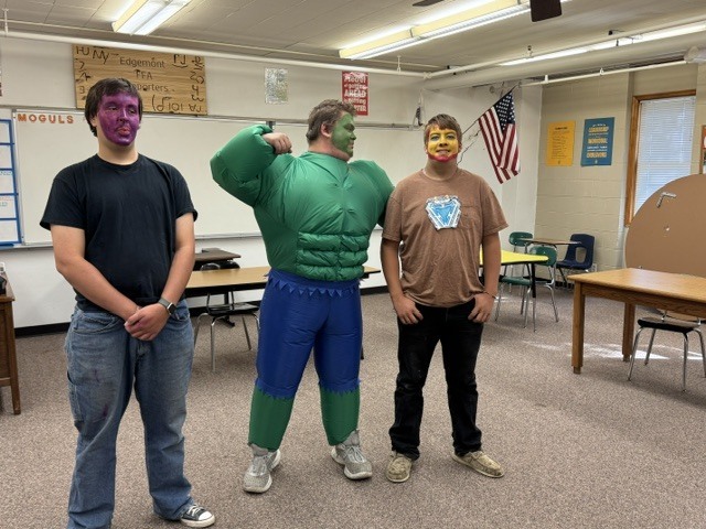 Students dressed as X Men, standing in a classroom