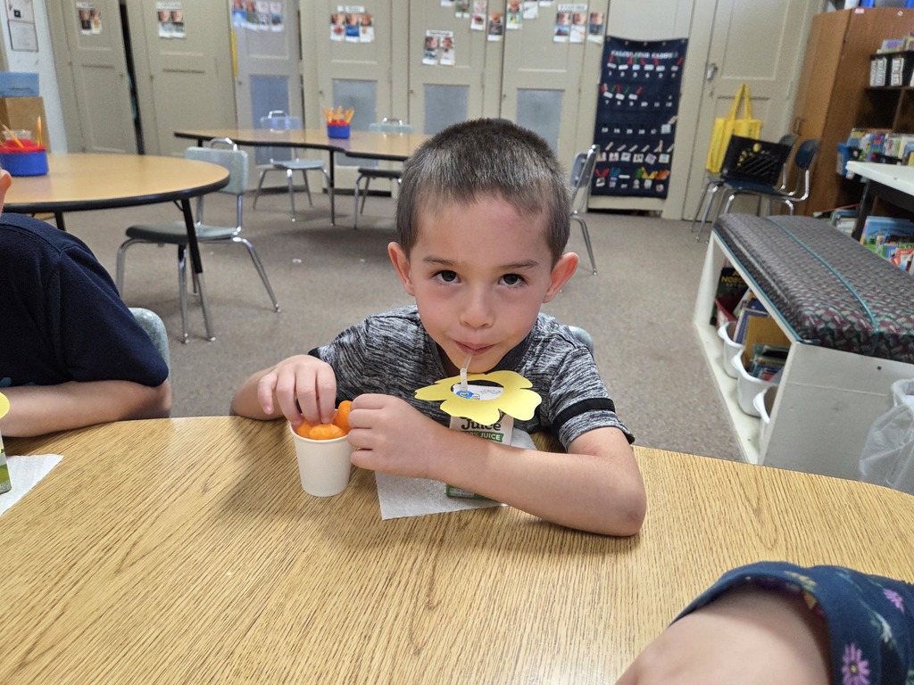 a boy drinking juice