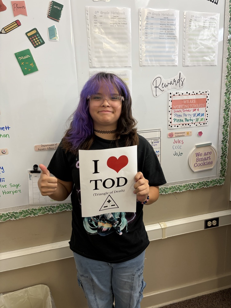 Student holding poster. 