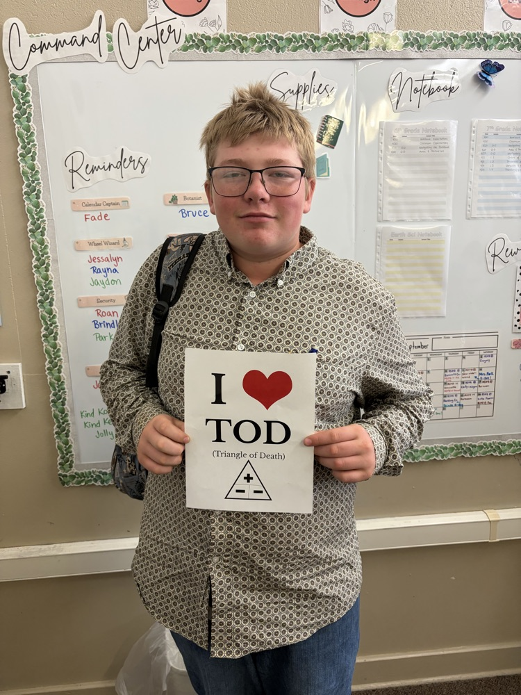 Student holding poster. 