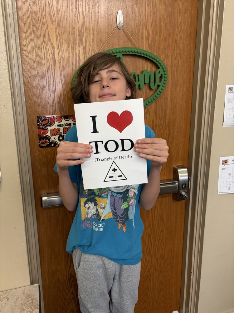 Student holding poster. 