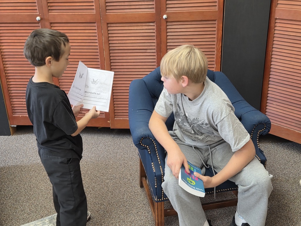 2 kids reading together
