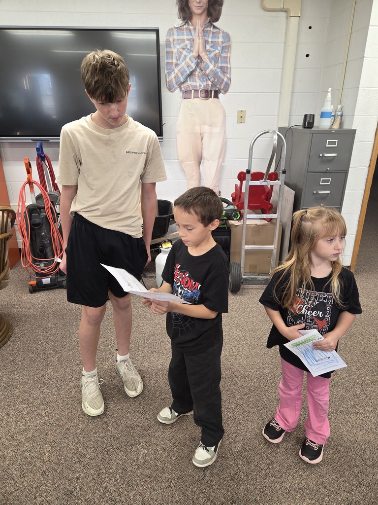3 kids reading together