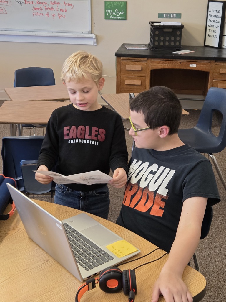2 kids reading together