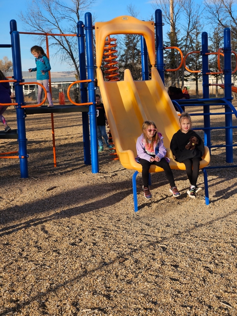 two kids on a slide