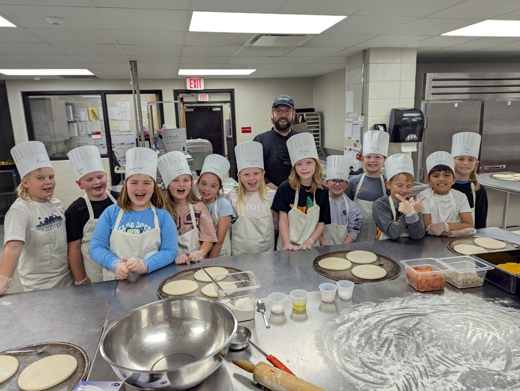 Group photo of kids in the kitchen.