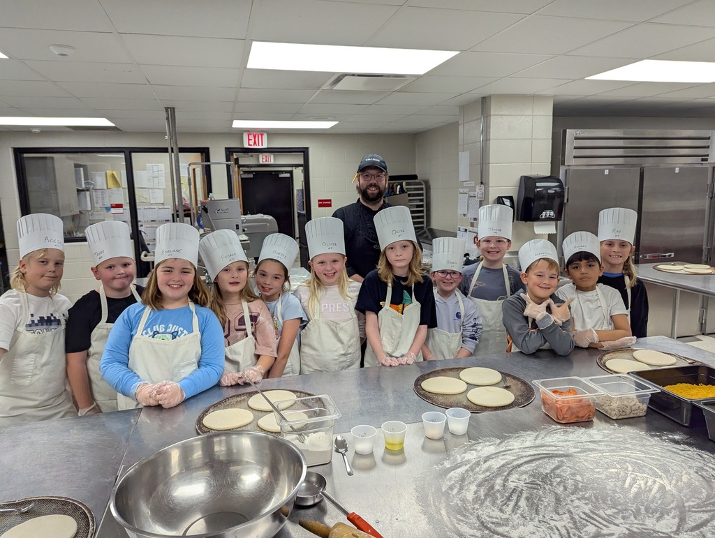 Group photo of kids in the kitchen.