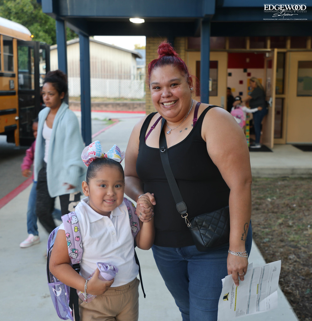 A mom drops her daughter off at RDLA for the first day of school