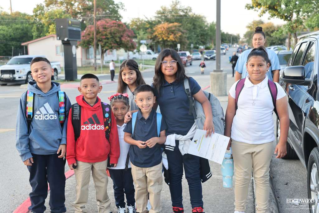 friends and sibligns walk to school together for the first day of school at RDLA