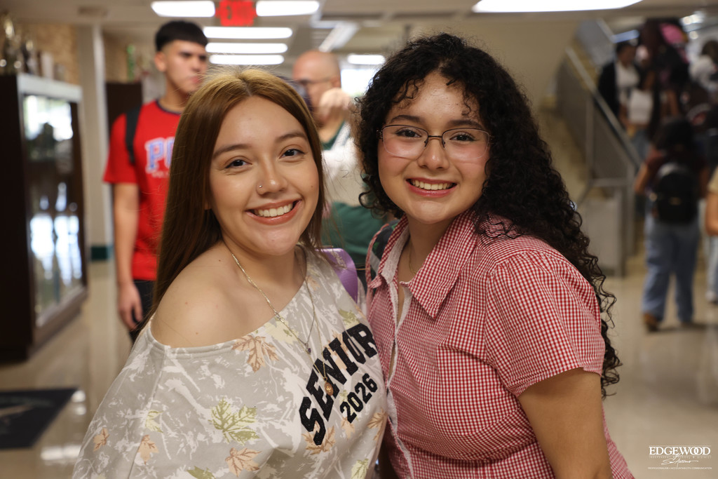 Two students from the class of 2026 smile for the first day of school