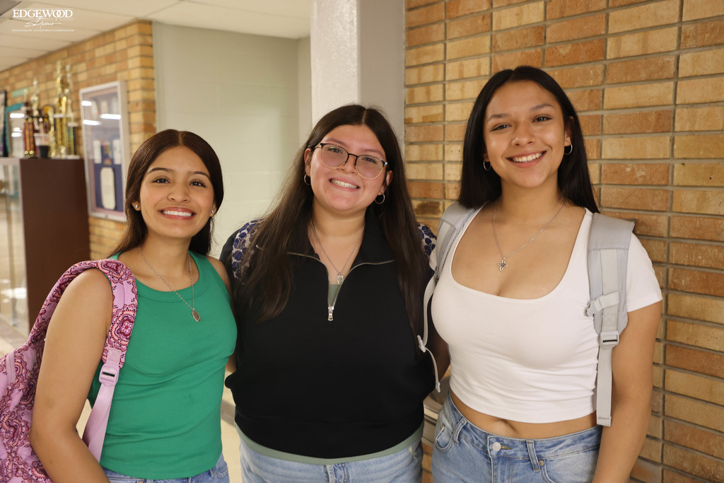 Three athletes are all smiles for the first day of school