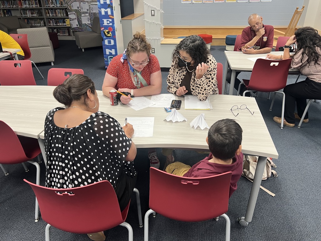 Ms. Olivarri, Ms. Squadrito, and Ms. Gutierrez drawing those place value charts!